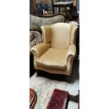 Upholstered wing back chair.