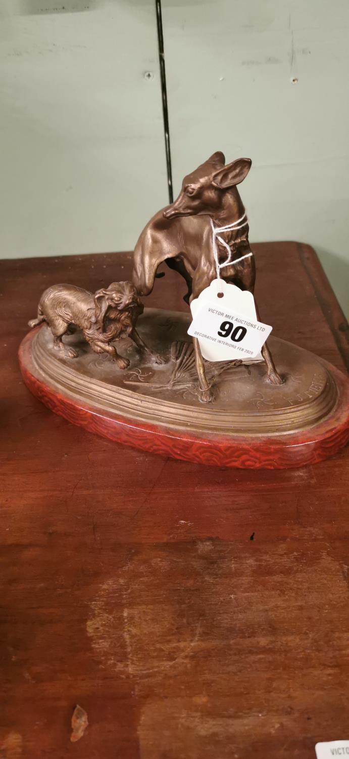 Brass model of a whippet and spaniel.