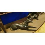 Pair of bronze models of reclining whippets.