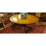 Regency style coramandel wood circular dining table.