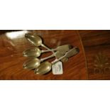 Set of four English silver dessert spoons.