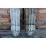 Pair of composition corbels in the form of scrolls.