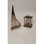 Chrome Yacht and brass carriage clock.