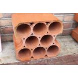 Six early 20th. C. terracotta wine racks.