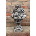 Stone finial depicting a bowl of fruit.