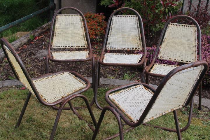 Set of five of metal and rattan upholstered garden chairs.