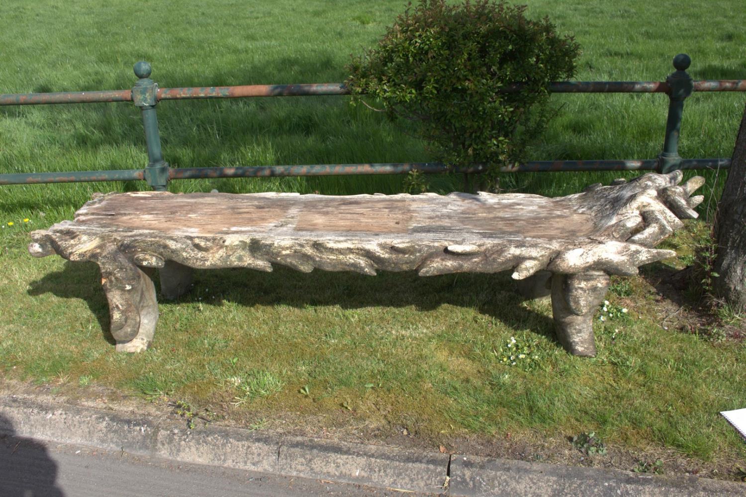 Large carved wooden garden bench.