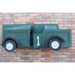 Wooden green car advertising wall plaque.