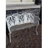 Decorative cast iron and wooden two seater bench.