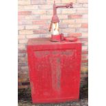 Late 1930s red oil cabinet.
