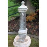 Stone pedestal water tap.