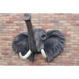 Wall plaque in the form of an elephant's head.