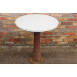 Cast iron table with marble top.