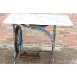 Cast iron sewing machine table with marble top.
