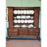 Early 19th C. inlaid oak Welsh dresser.