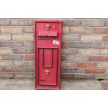 Cast aluminium panel of post box front.