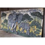 Painted coloured wall plaque depicting Elephants.