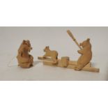 Two hand carved wooden toys.