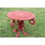 Decorative cast iron red jardiniere stand.