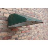 Collection of fourteen retro green enamel wall light shades.