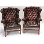 Pair of 19th C. deep buttoned cigar leather Chesterfield wing back arm chairs.