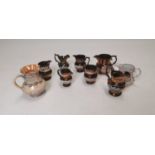 Collection of nine 19th C. Luster jugs.