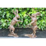 Pair of bronze models of fighting Hares.