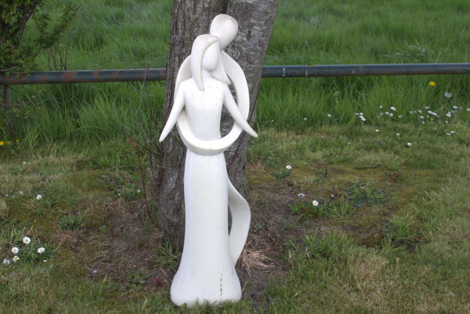 Contemporary stone statue of lovers.