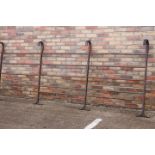 Set of six steel gates or fencing with four hooks .