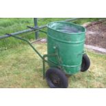 Green garden bin on trolley .