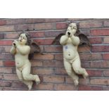 Pair of wall mounted cherubs.