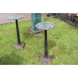 Pair of Art Deco style cast iron tables with marble tops.