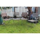 Set of four wooden and metal garden chairs.