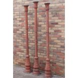 Three decorative terracotta coloured aluminium columns.
