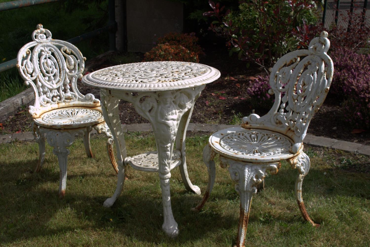 Decorative cast iron three piece garden set.