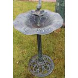 Green aluminium bird bath.