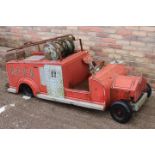 Child's pedal fire engine.