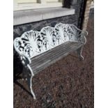 Decorative cast iron and wooden three seater bench.