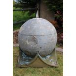 Aluminium pier cap in the form of a globe.