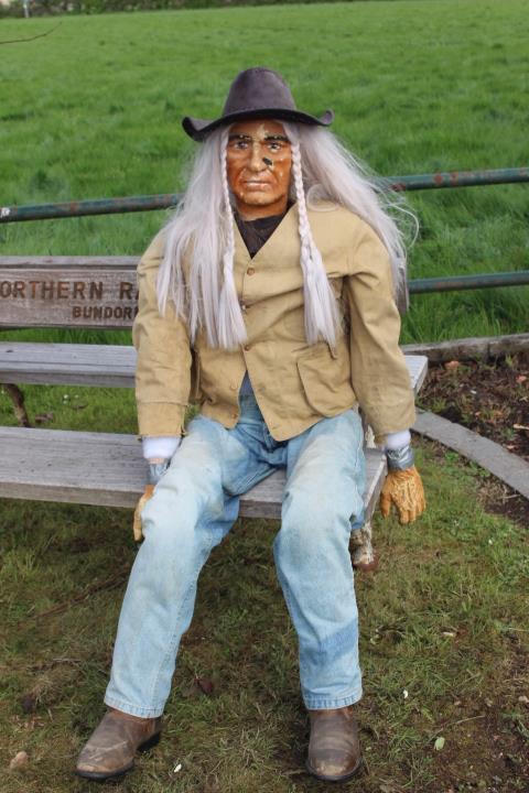 Model of a seated Native American Indian.