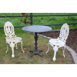 Pair of decorative cast iron garden chairs.
