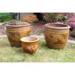Two matching terracotta pots and another.