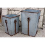Two square metal garden planters.