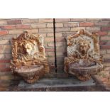 Pair of decorative cast iron wall water fountains.