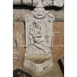 Cast iron wall mounted water feature depicting Neptune and fish.