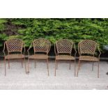 Set of four metal garden chairs.