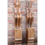 Two decorative wooden corbels.