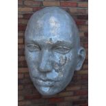 Mosaic glass wall mounted face.