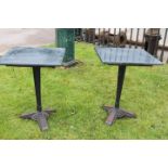 Pair of Art Deco style cast iron tables with marble tops.