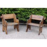 Pair of wooden garden seats in the Gothic style.